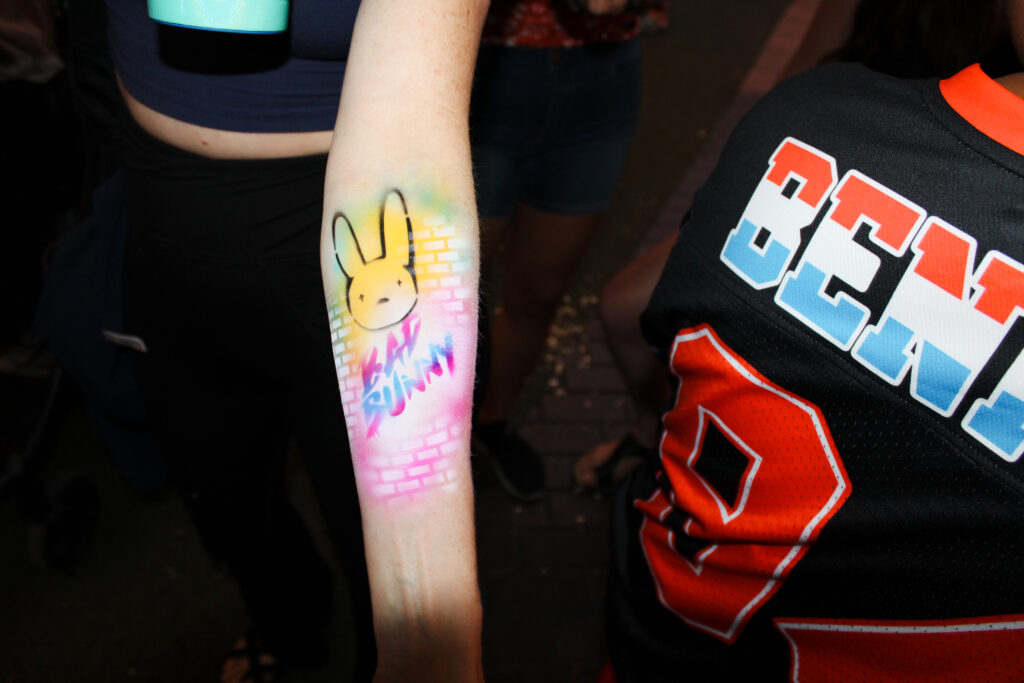 Airbrush temporary tattoo on a woman's forearm at an Arizona party